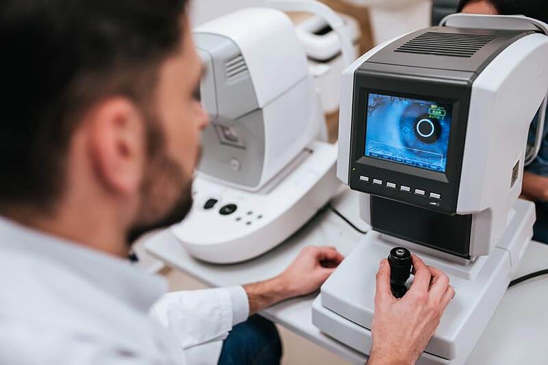 Doctor looking at a digital scan of a patients eye