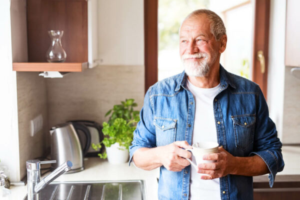 mature man drinking a cup of coffee